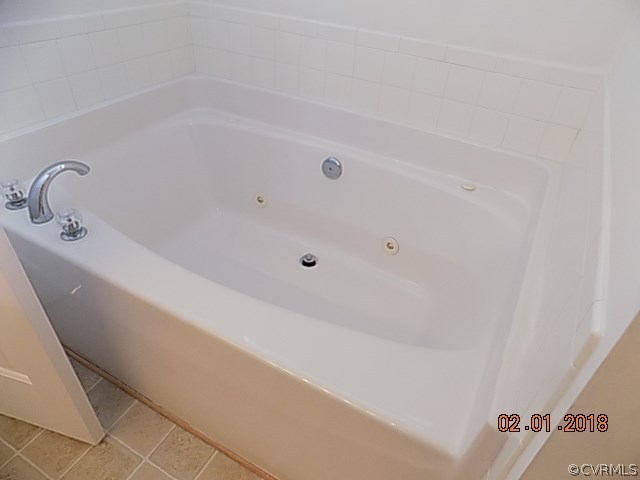 9324 Alcove Grove Road Chesterfield, VA 23832 - Photo 21 of 29 a bathroom with a bathtub
