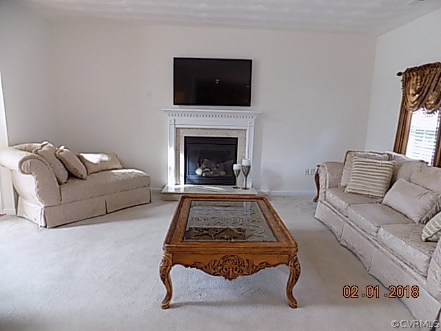 9324 Alcove Grove Road Chesterfield, VA 23832 - Photo 5 of 29 a living room with furniture and a fireplace