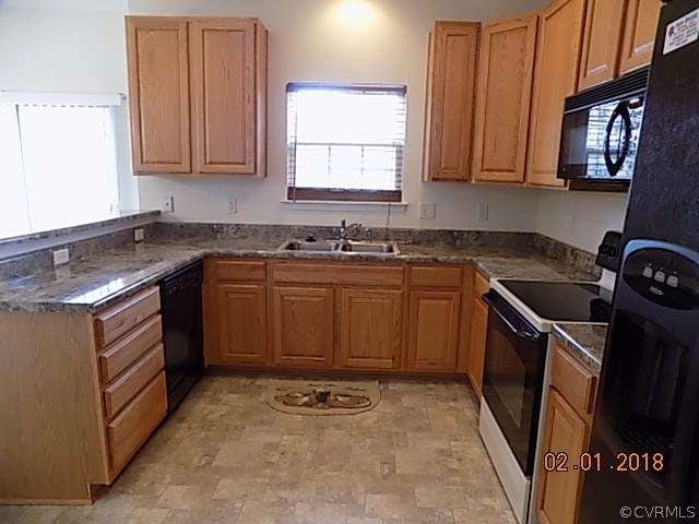 9324 Alcove Grove Road Chesterfield, VA 23832 - Photo 9 of 29 a kitchen with a sink stove top oven and cabinets
