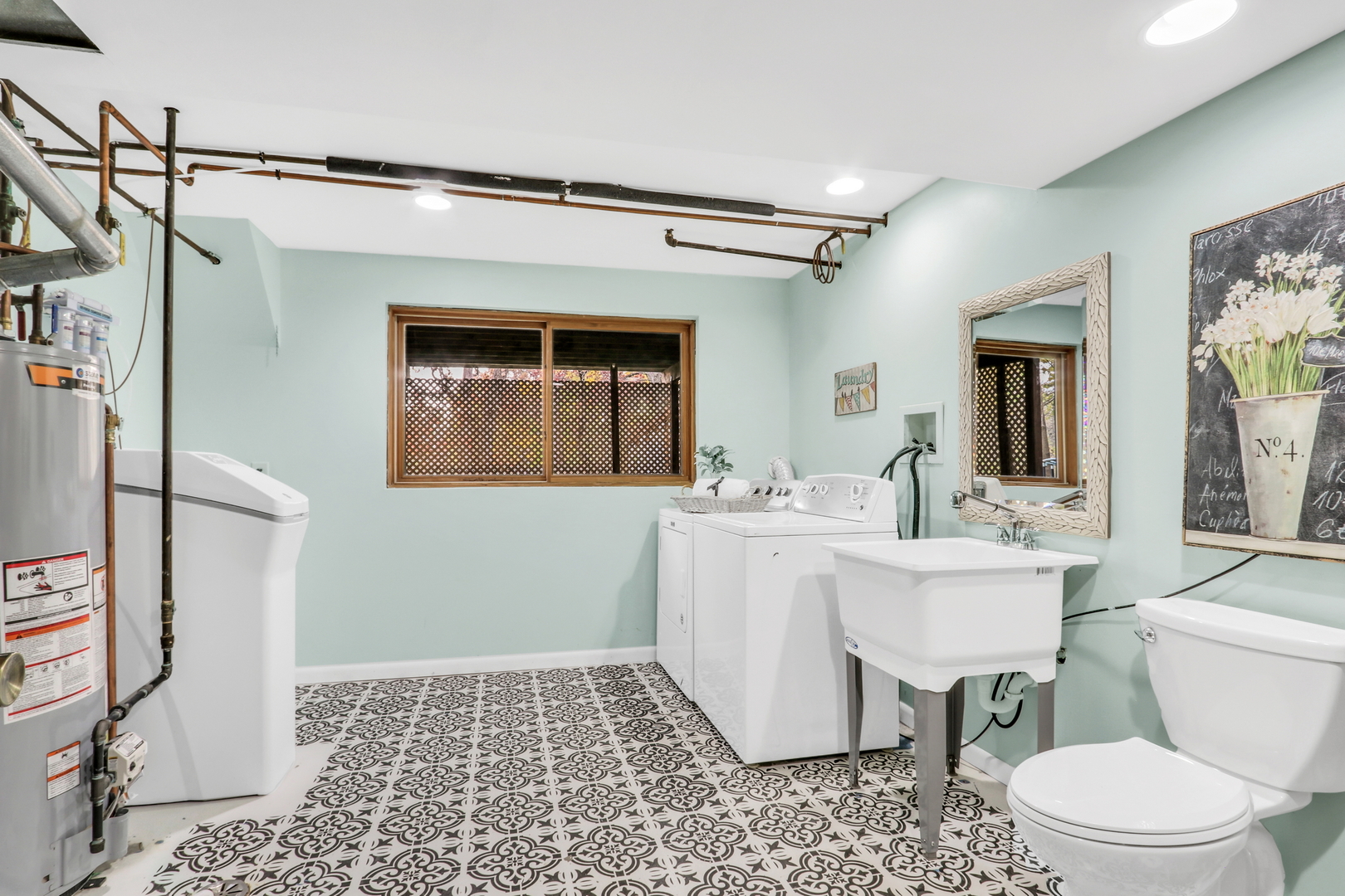 25911 West Highpoint Road Ingleside, IL 60041 - Photo 19 of 29 a bathroom with a sink toilet a mirror and shower