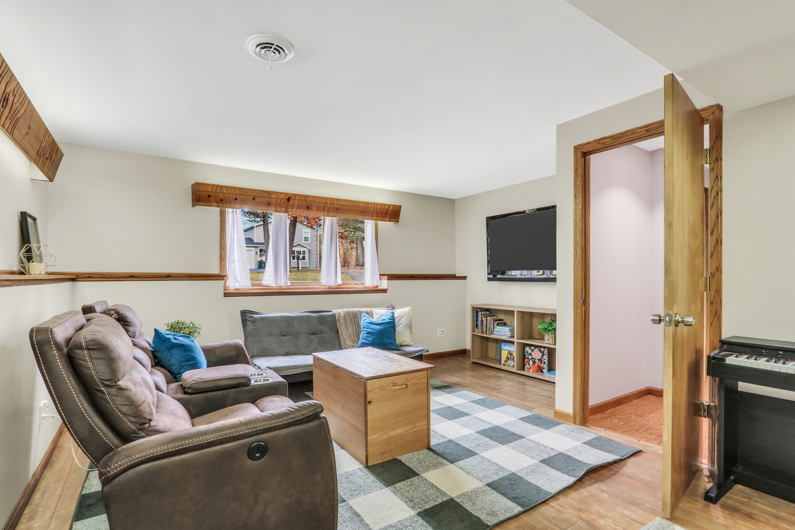 25911 West Highpoint Road Ingleside, IL 60041 - Photo 20 of 29 a living room with furniture a flat screen tv and a fireplace
