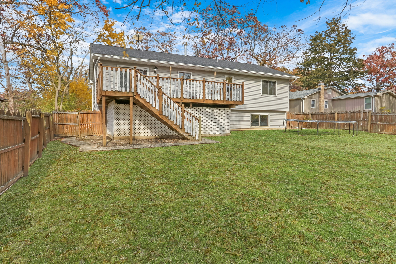 25911 West Highpoint Road Ingleside, IL 60041 - Photo 22 of 29 a view of a house with a yard and deck