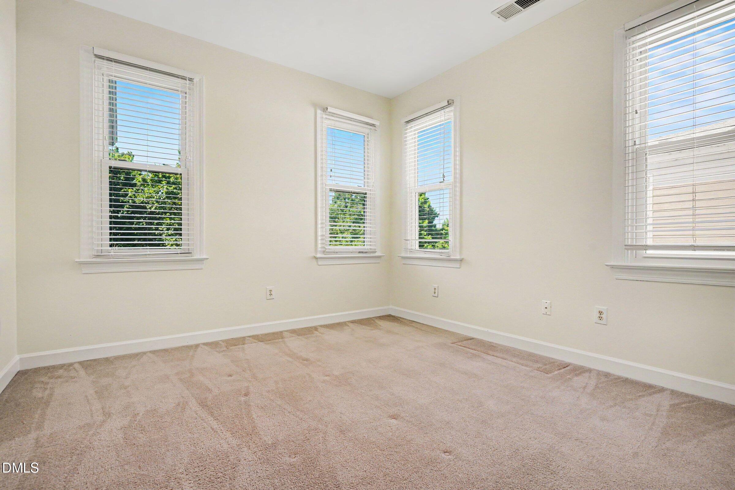 2651 Mellowfield Drive, Unit 203 Raleigh, NC 27604 - Photo 17 of 32 an empty room with windows