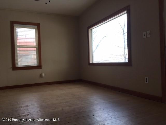433 East 2nd Street Rifle, CO 81650 - Photo 3 of 8 a view of an empty room with a window