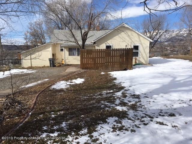 433 East 2nd Street Rifle, CO 81650 - Photo 8 of 8 a view of a large house with a yard covered with snow