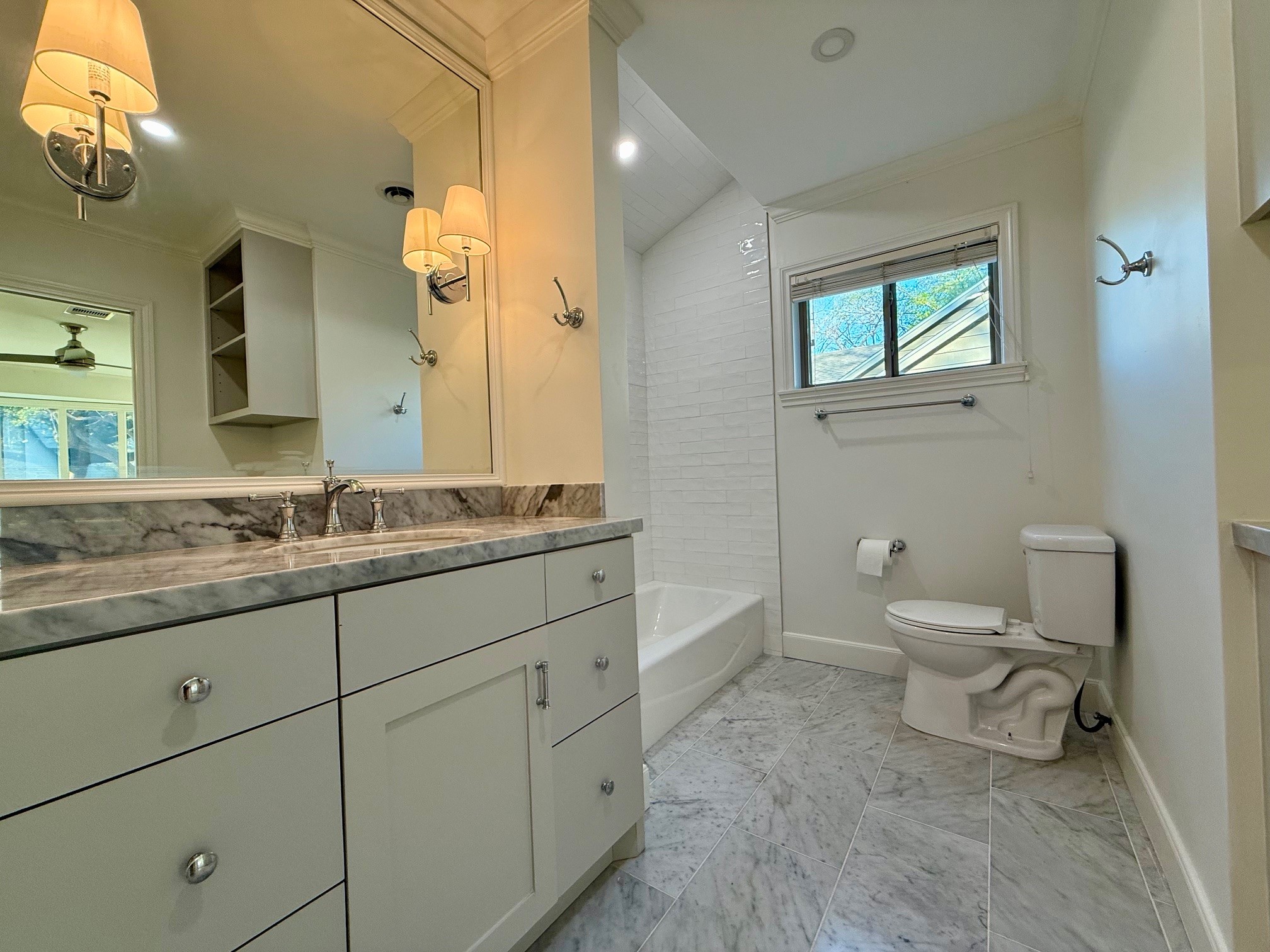 4726 Ivanhoe Street Houston, TX 77027 - Photo 14 of 22 Secondary bath has extended vanity and is adorned in natural stone