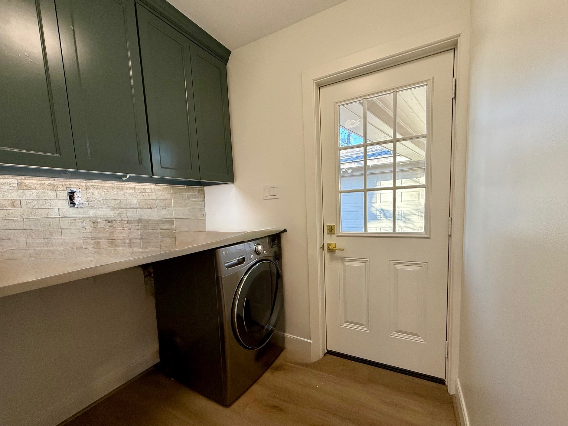 4726 Ivanhoe Street Houston, TX 77027 - Photo 16 of 22 Utility Room in home leads to the back door and garage.