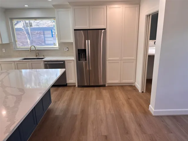 a bathroom with a toilet a sink and shower