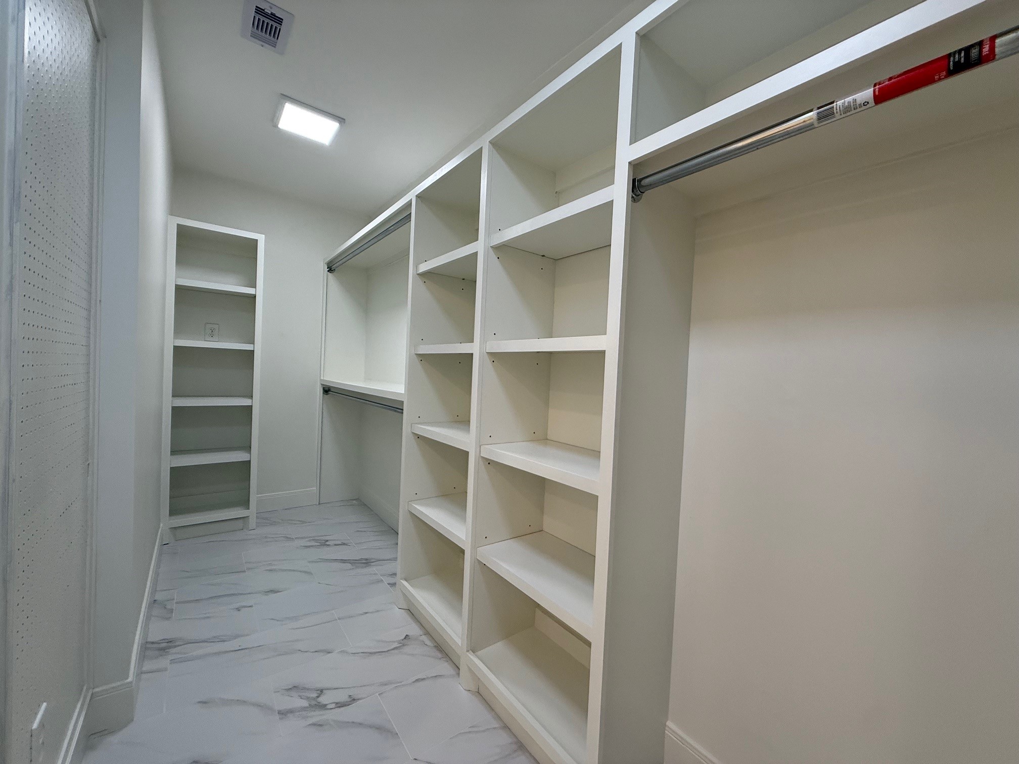 4726 Ivanhoe Street Houston, TX 77027 - Photo 21 of 22 Large walk-in closet for the primary has plenty of hanging space and lots of shelving