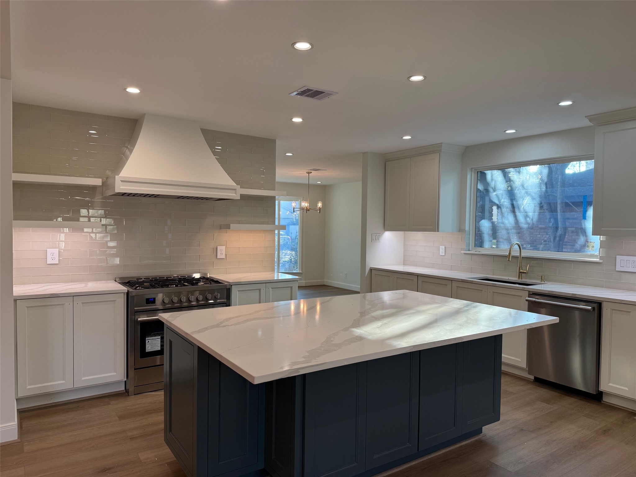 4726 Ivanhoe Street Houston, TX 77027 - Photo 3 of 22 First let's go to the heart of the home. Kitchen has an uninterrupted island and stainless-steel appliances