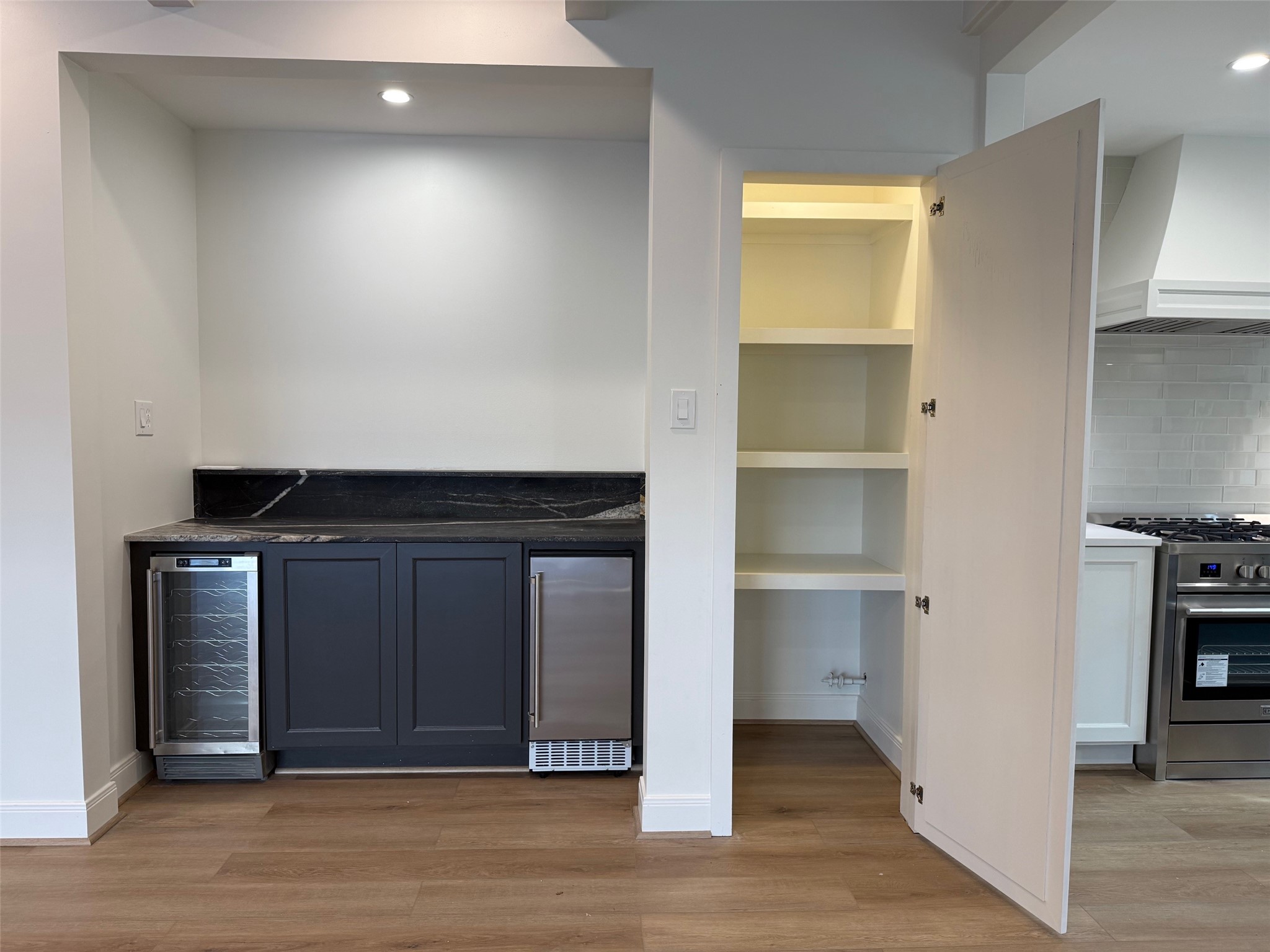 4726 Ivanhoe Street Houston, TX 77027 - Photo 8 of 22 Recessed bar has natural stone top with ice maker and beverage chiller below, making entertaining a breeze. And look at the extra storage closet!