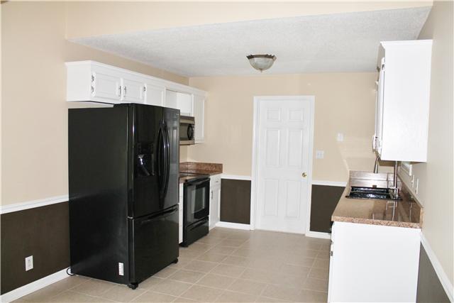 2935 Jack Teasley Road Pleasant View, TN 37146 - Photo 8 of 18 Galley kitchen with attached laundry/mud room