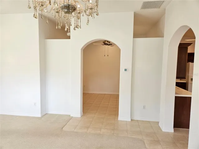 a view of a livingroom with a white painted wall