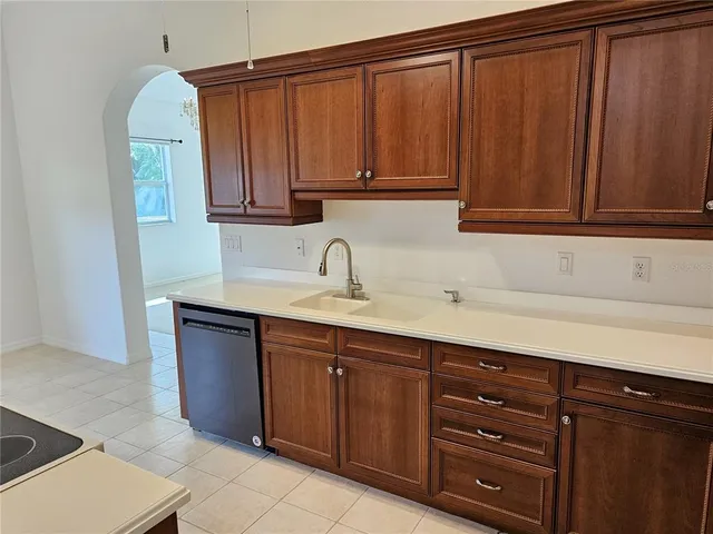 a kitchen with a sink and cabinets