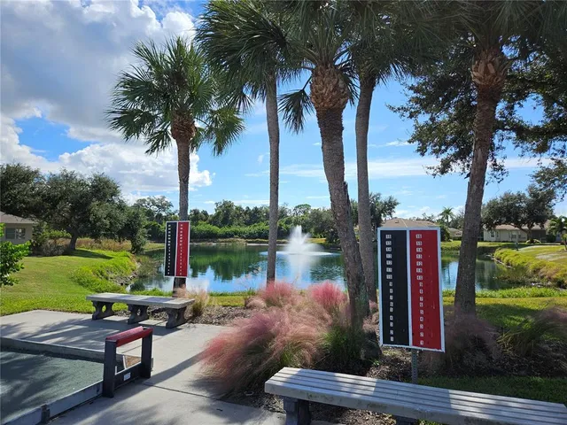 a view of a park with plants and lake view