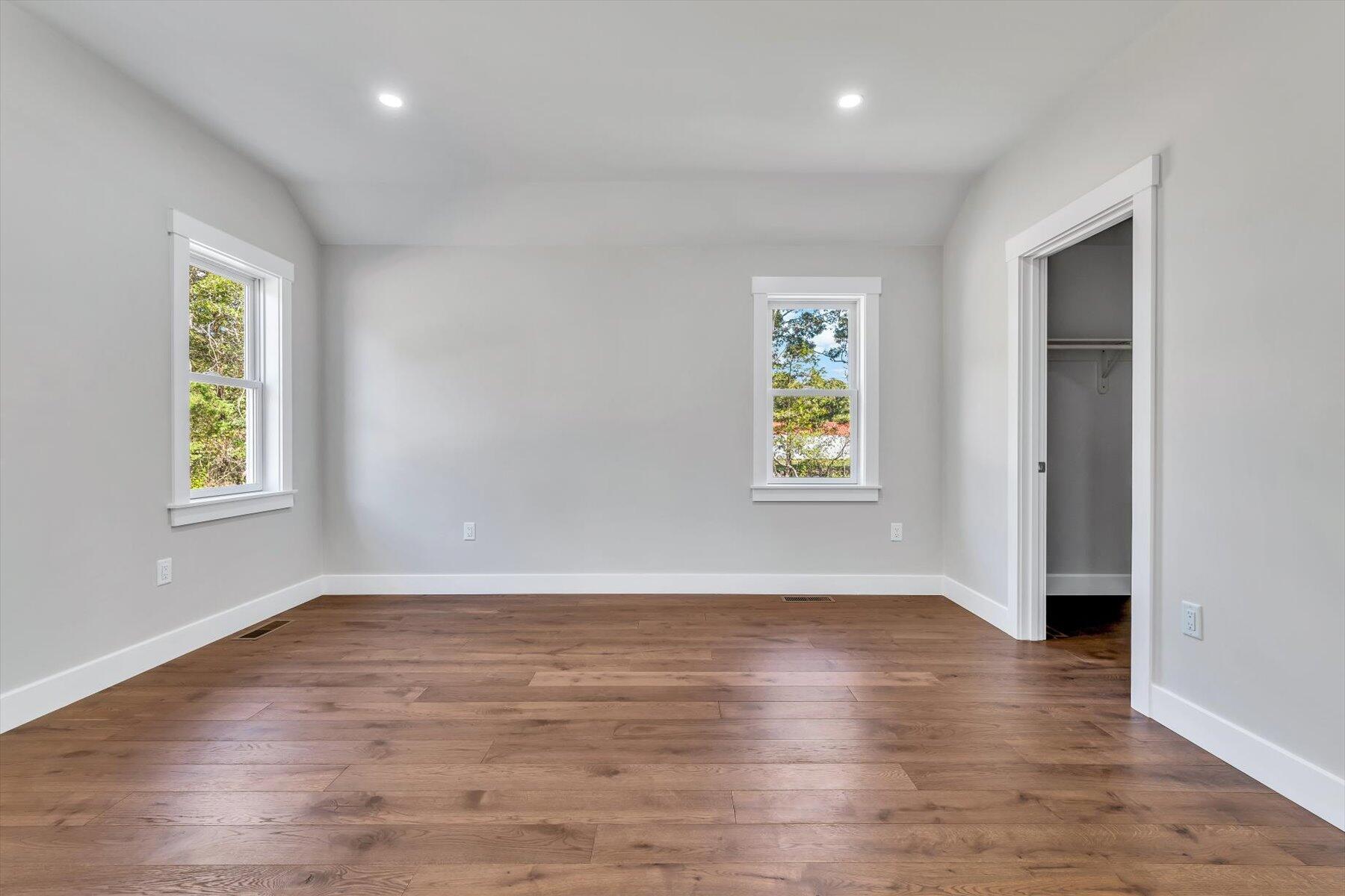 25 Percival Road East Falmouth, MA 02536 - Photo 15 of 31 an empty room with wooden floor and windows