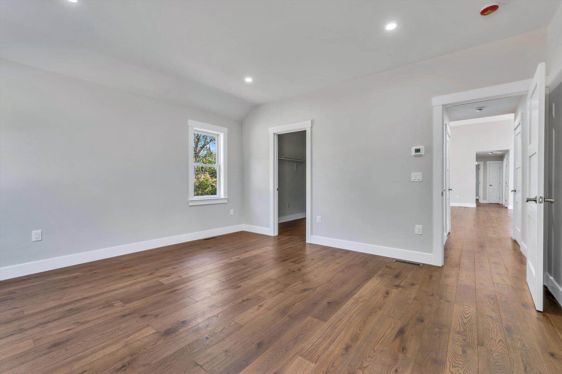 25 Percival Road East Falmouth, MA 02536 - Photo 21 of 31 a view of an empty room with wooden floor and a window