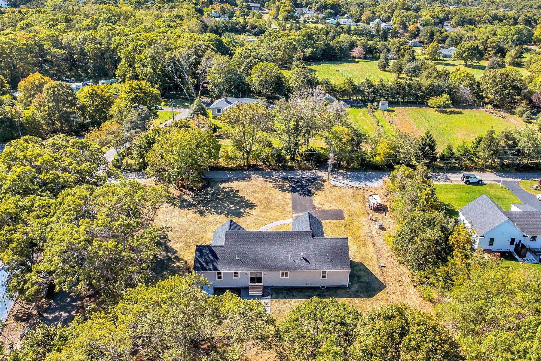 25 Percival Road East Falmouth, MA 02536 - Photo 3 of 31 a view of a lake with a house