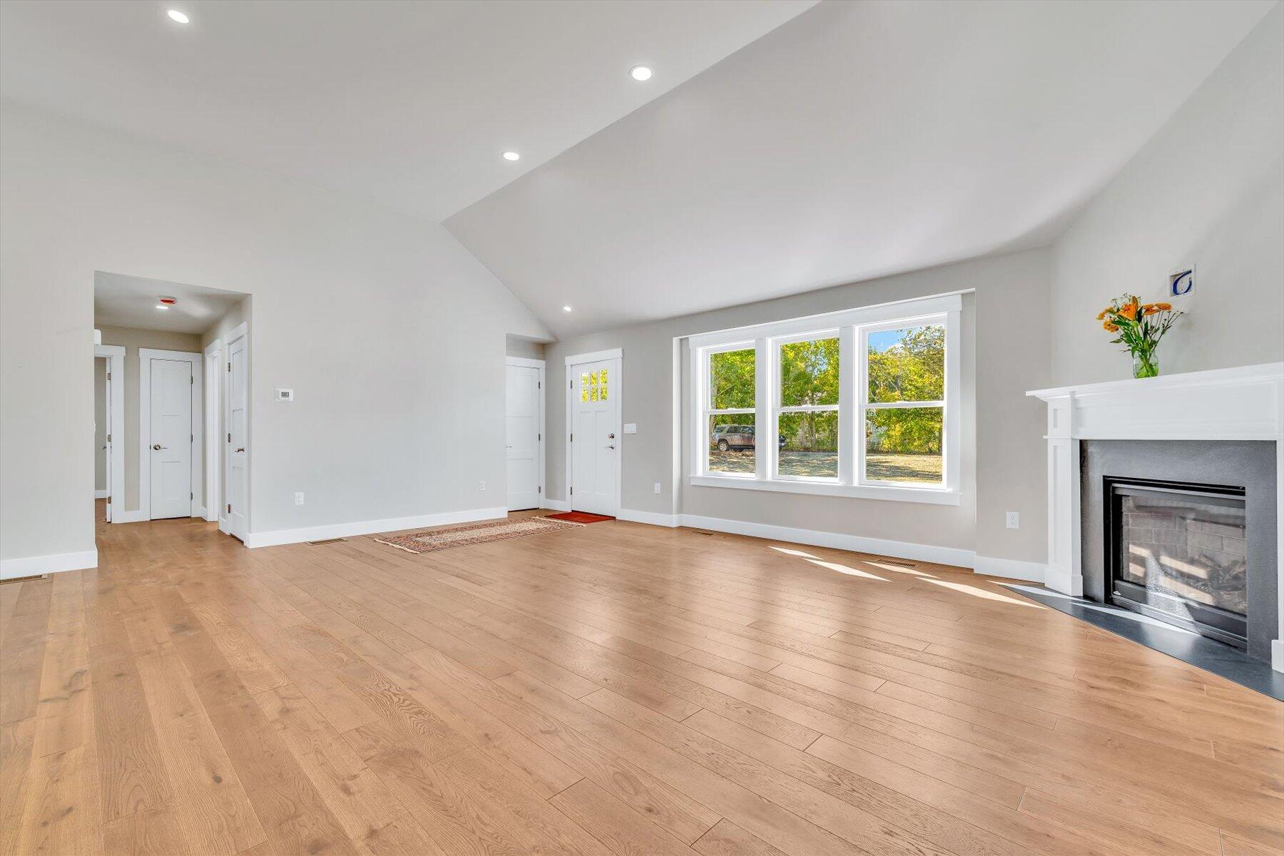 25 Percival Road East Falmouth, MA 02536 - Photo 5 of 31 an empty room with windows and a fireplace