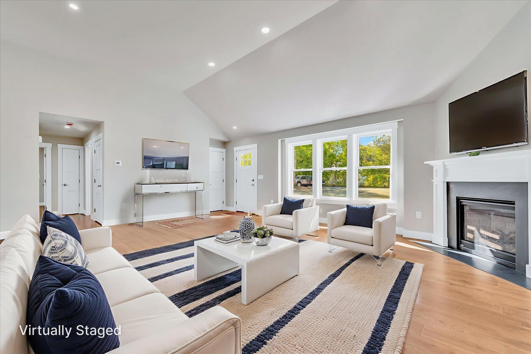 25 Percival Road East Falmouth, MA 02536 - Photo 6 of 31 a living room with furniture fireplace and a flat screen tv