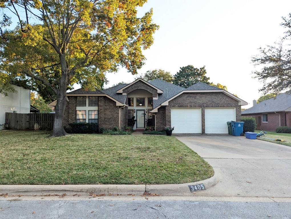 a house that has a tree in front of a house