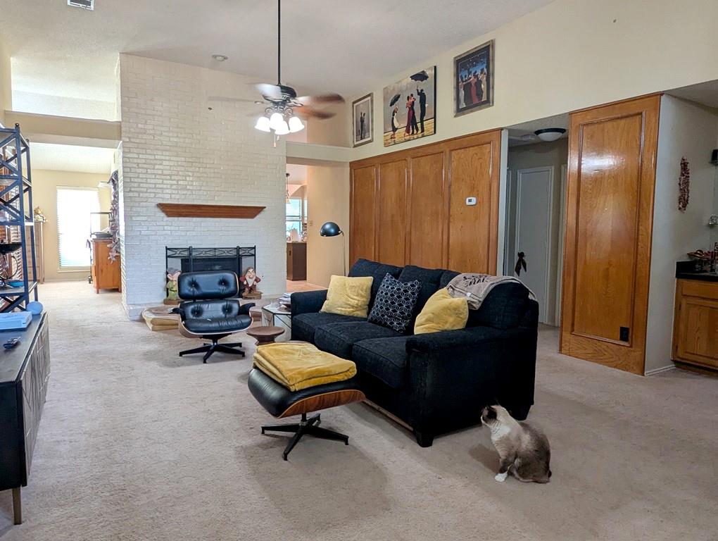 3405 Spring Willow Drive Grapevine, TX 76051 - Photo 5 of 9 a living room with furniture and a fireplace