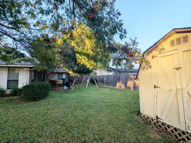a backyard of a house with seating space