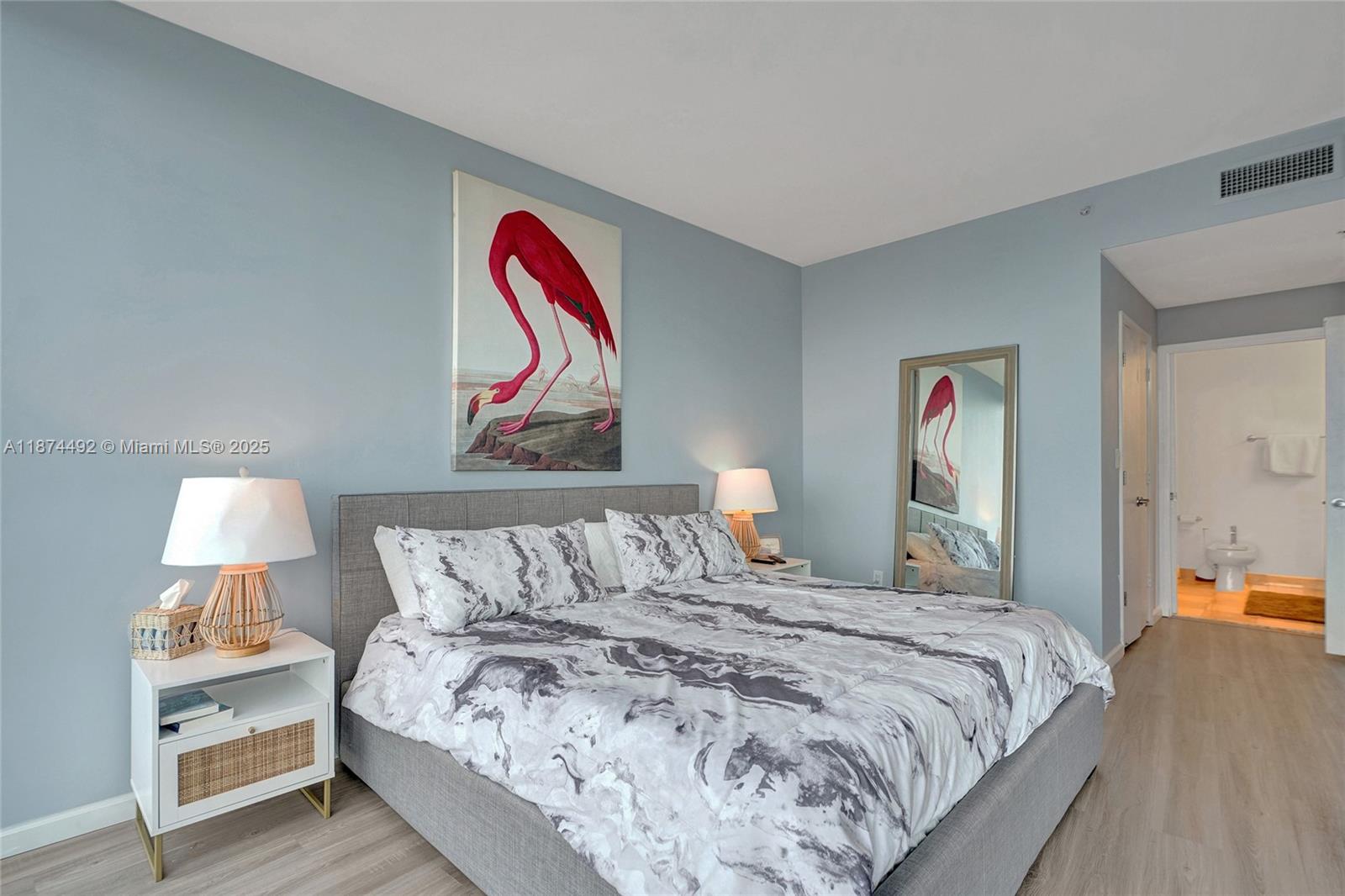 601 Northeast 36th Street, Unit 2703 Miami, FL 33137 - Photo 15 of 64 a bedroom with a bed and a lamp