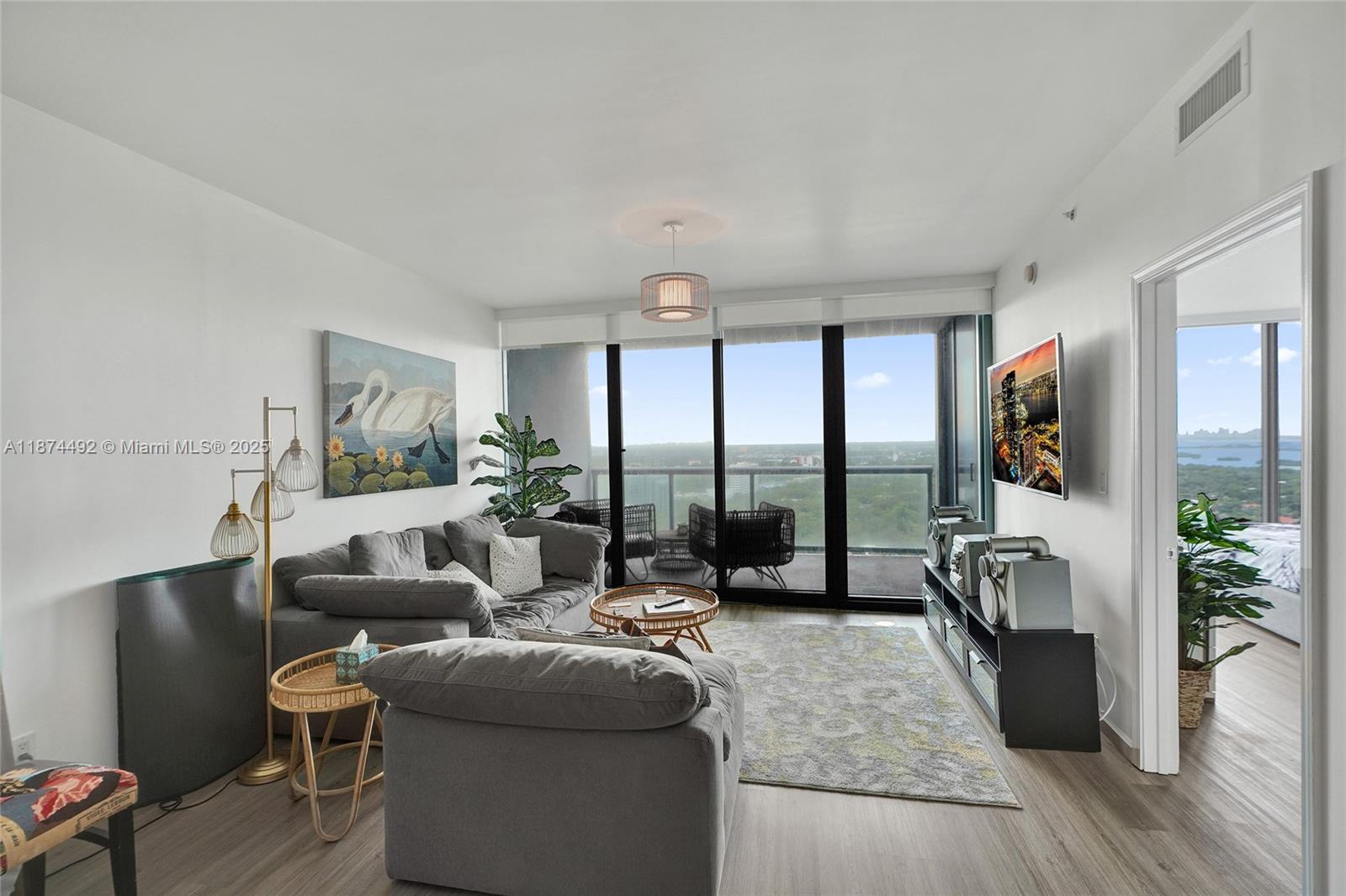 601 Northeast 36th Street, Unit 2703 Miami, FL 33137 - Photo 25 of 64 a living room with furniture and a large window