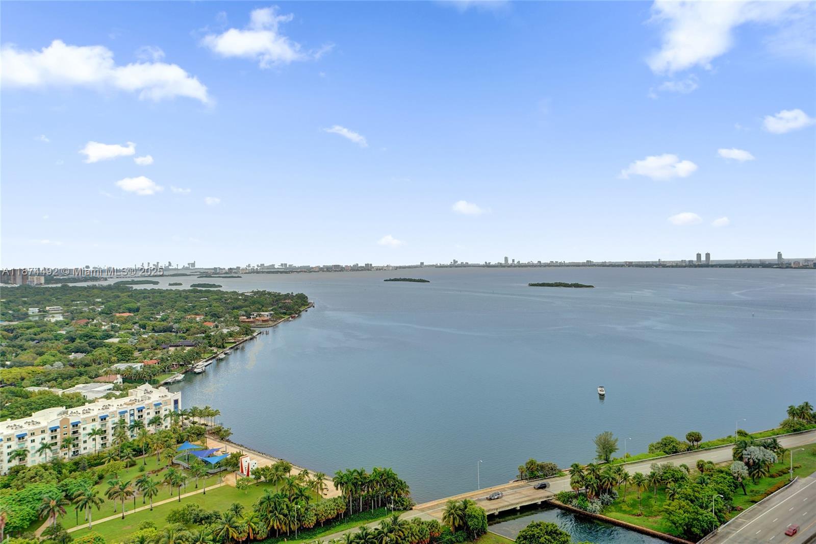 601 Northeast 36th Street, Unit 2703 Miami, FL 33137 - Photo 39 of 64 a view of a lake with a beach