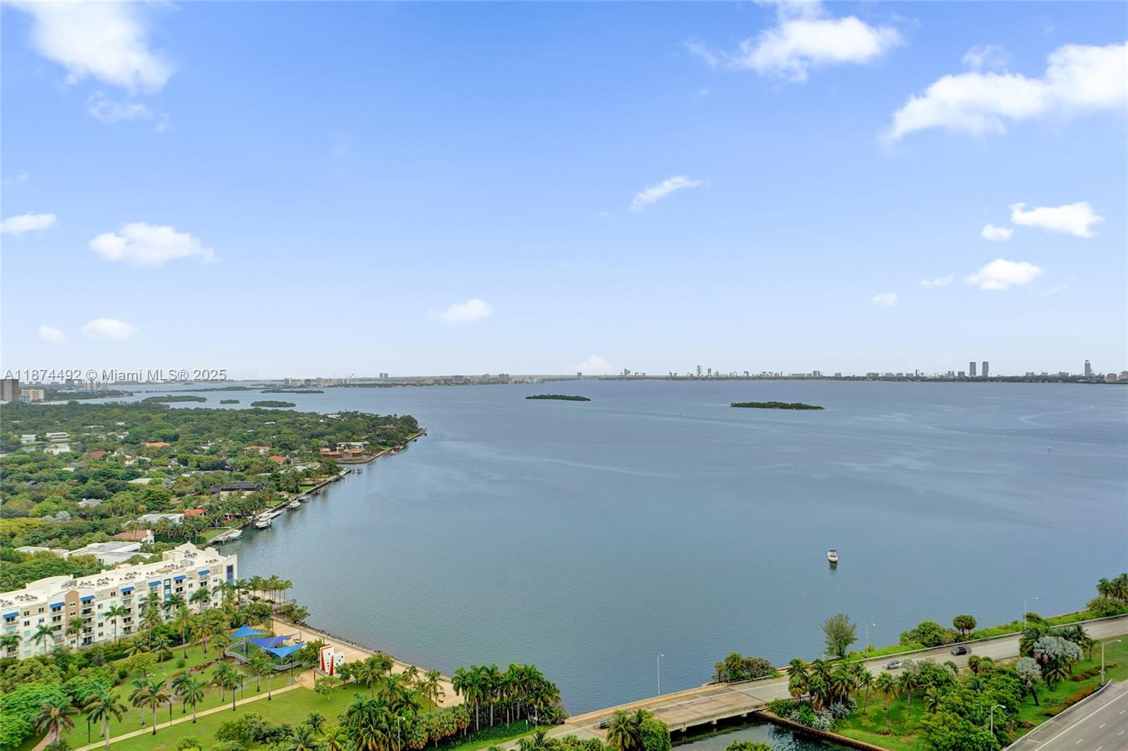 601 Northeast 36th Street, Unit 2703 Miami, FL 33137 - Photo 4 of 64 a view of a lake with a beach
