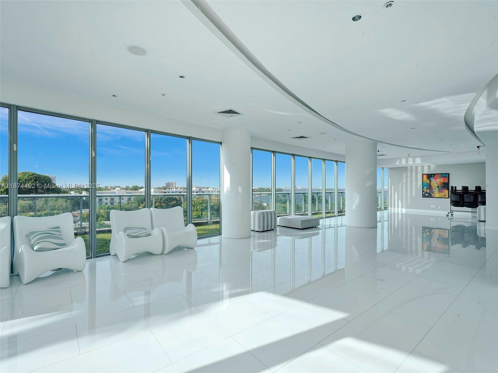 601 Northeast 36th Street, Unit 2703 Miami, FL 33137 - Photo 46 of 64 a living room with furniture and a large window