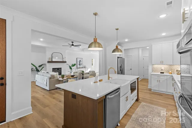 a kitchen that has a lot of cabinets in it