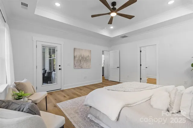 a bedroom with a bed couch and window