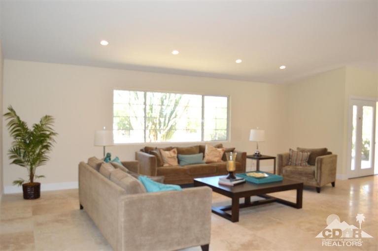 72825 Bel Air Road Palm Desert, CA 92260 - Photo 11 of 23 a living room with furniture and a large window