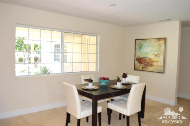 72825 Bel Air Road Palm Desert, CA 92260 - Photo 13 of 23 a view of a dining room with furniture window and outside view