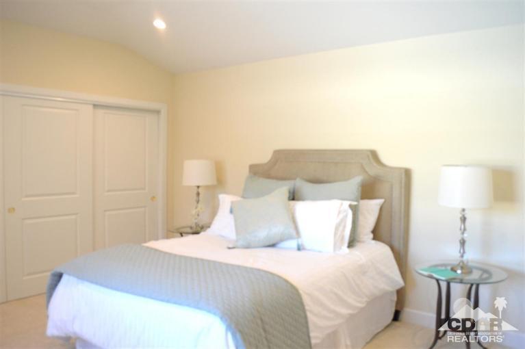 72825 Bel Air Road Palm Desert, CA 92260 - Photo 14 of 23 a bedroom with a bed and a table