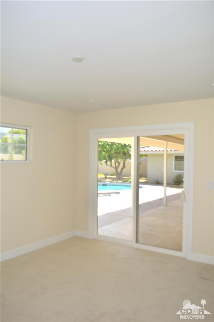 72825 Bel Air Road Palm Desert, CA 92260 - Photo 15 of 23 a view of an empty room with a window