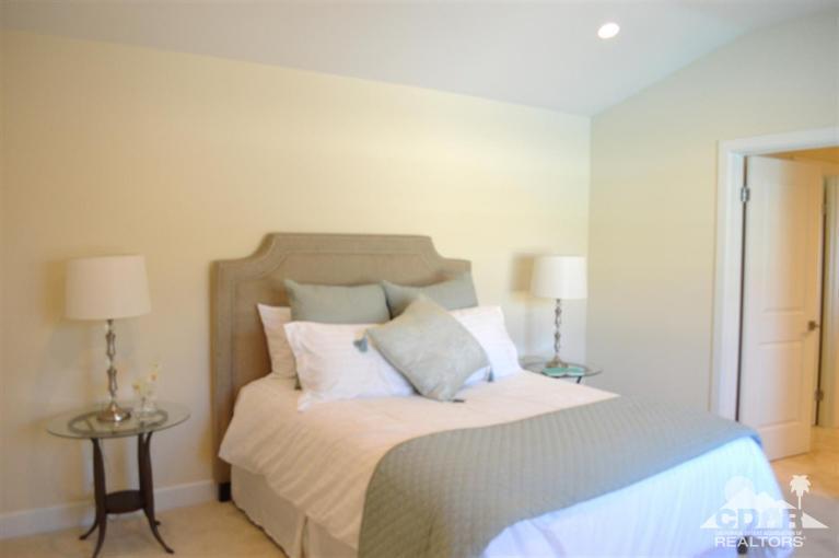 72825 Bel Air Road Palm Desert, CA 92260 - Photo 16 of 23 a bedroom with a bed and a lamp