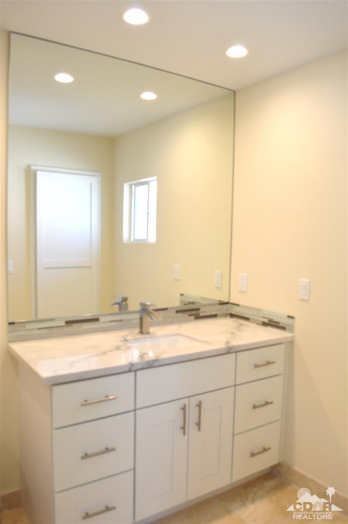 72825 Bel Air Road Palm Desert, CA 92260 - Photo 18 of 23 a bathroom with a granite countertop sink mirror and double