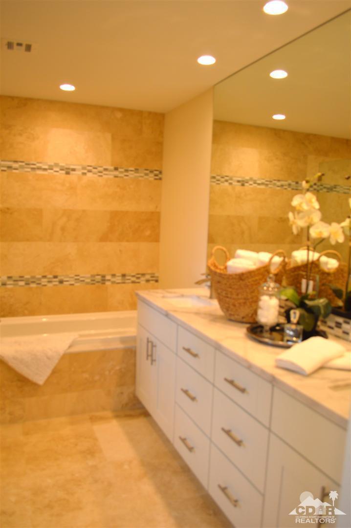 72825 Bel Air Road Palm Desert, CA 92260 - Photo 20 of 23 a view of a bathroom with a tub and a shower