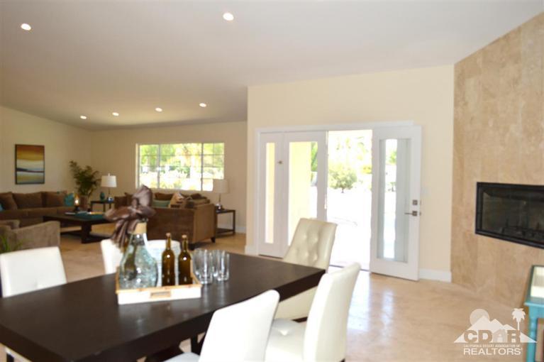72825 Bel Air Road Palm Desert, CA 92260 - Photo 5 of 23 a living room with furniture and a large window