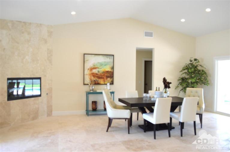 72825 Bel Air Road Palm Desert, CA 92260 - Photo 9 of 23 a view of a dining room with furniture and a potted plant