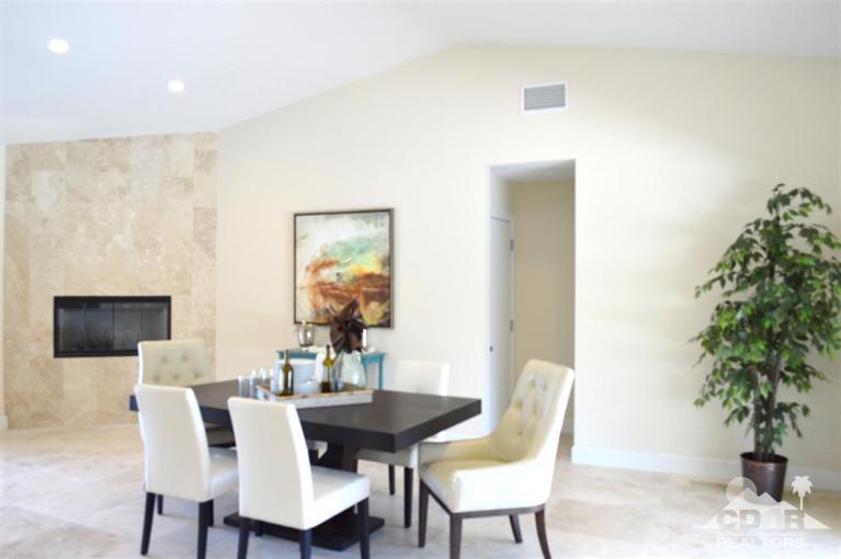 72825 Bel Air Road Palm Desert, CA 92260 - Photo 10 of 23 a view of a dining room with furniture and wooden floor