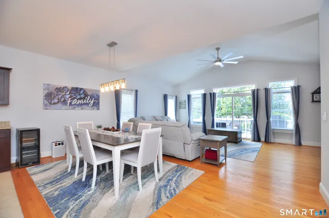 a view of a dining room with furniture window and wooden floor