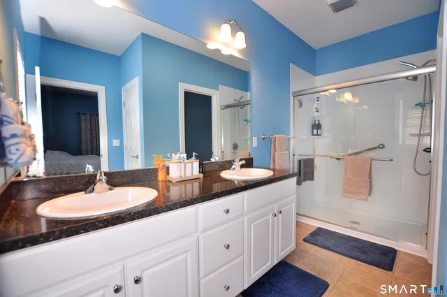 a bedroom with a bed and a television