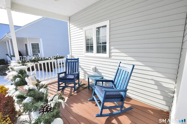 a view of a chair and table in the balcony