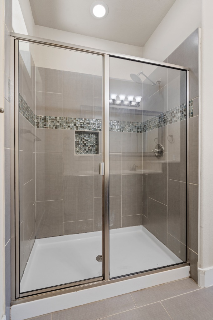 11229 Avery Station Loop, Unit 36 Austin, TX 78717 - Photo 16 of 37 Full bath with light tile patterned flooring, a shower stall, and recessed lighting