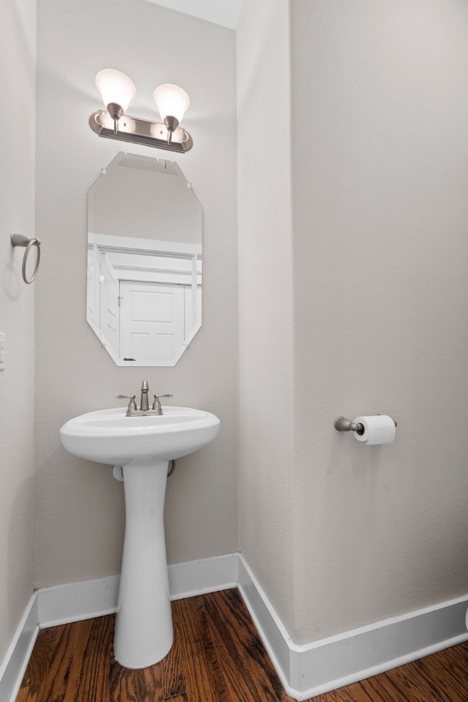 11229 Avery Station Loop, Unit 36 Austin, TX 78717 - Photo 19 of 37 Half bath with baseboards and dark wood finished floors