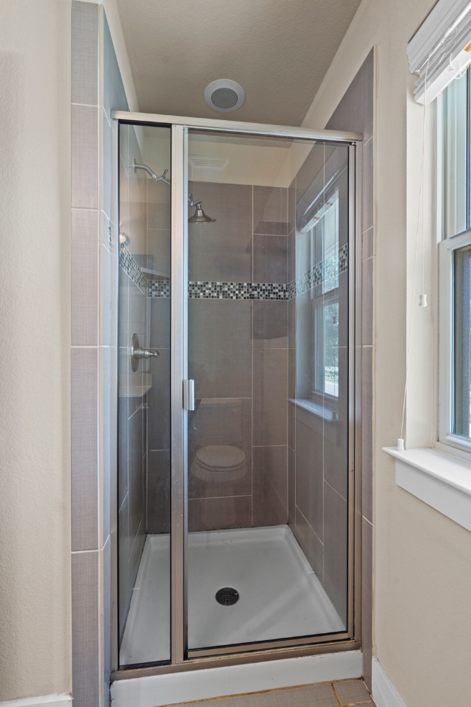 11229 Avery Station Loop, Unit 36 Austin, TX 78717 - Photo 26 of 37 Full bathroom with a stall shower and light tile patterned flooring